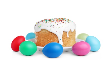 Photo of Traditional Easter cake and colorful eggs on white background