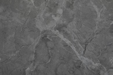 Photo of Texture of dark grey marble surface as background, closeup