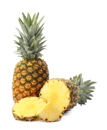 Tasty raw pineapple with slices on white background