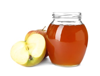 Photo of Glass jar with sweet honey and apples on white background