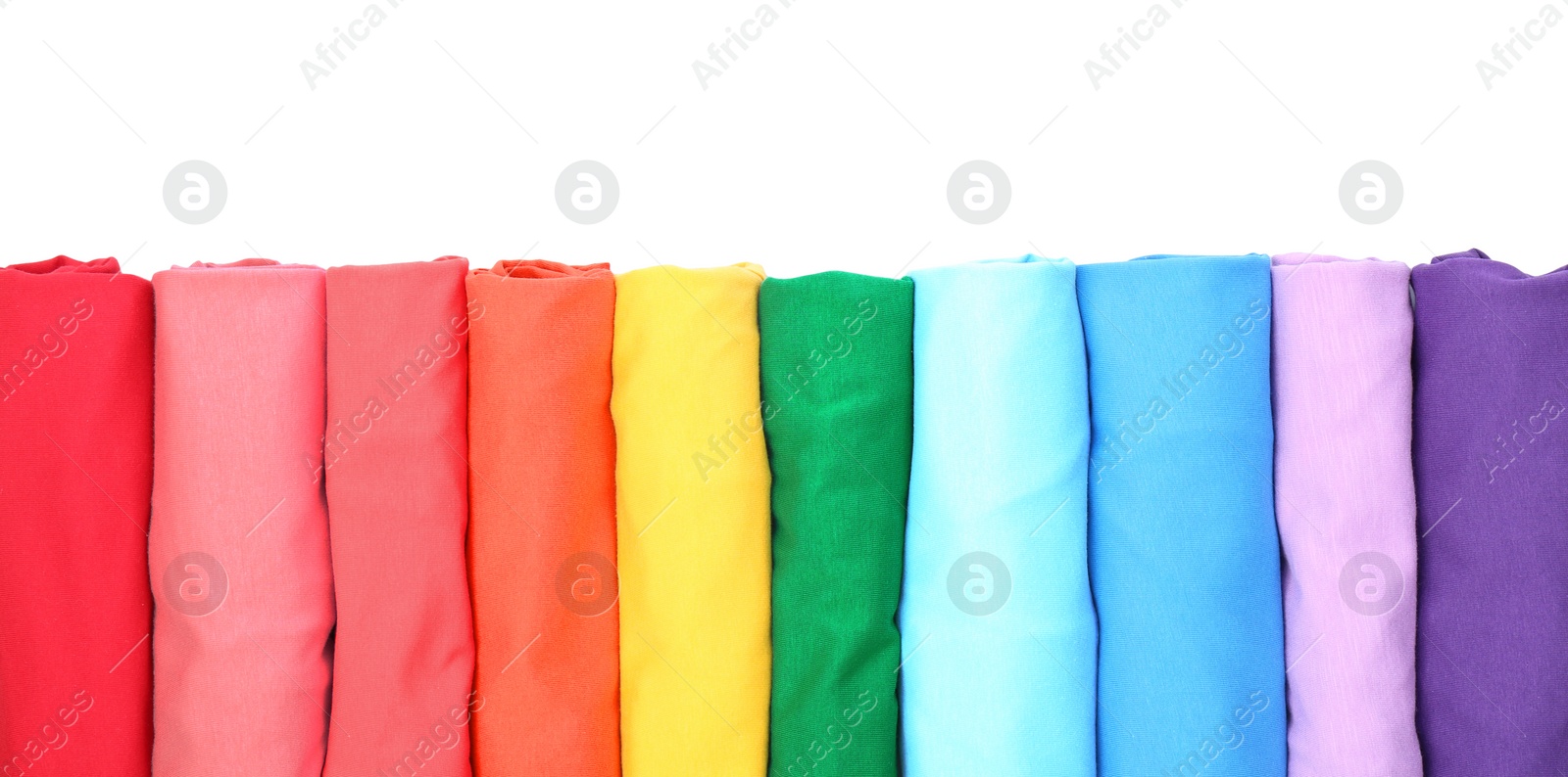 Photo of Colorful collection of t-shirts on white background