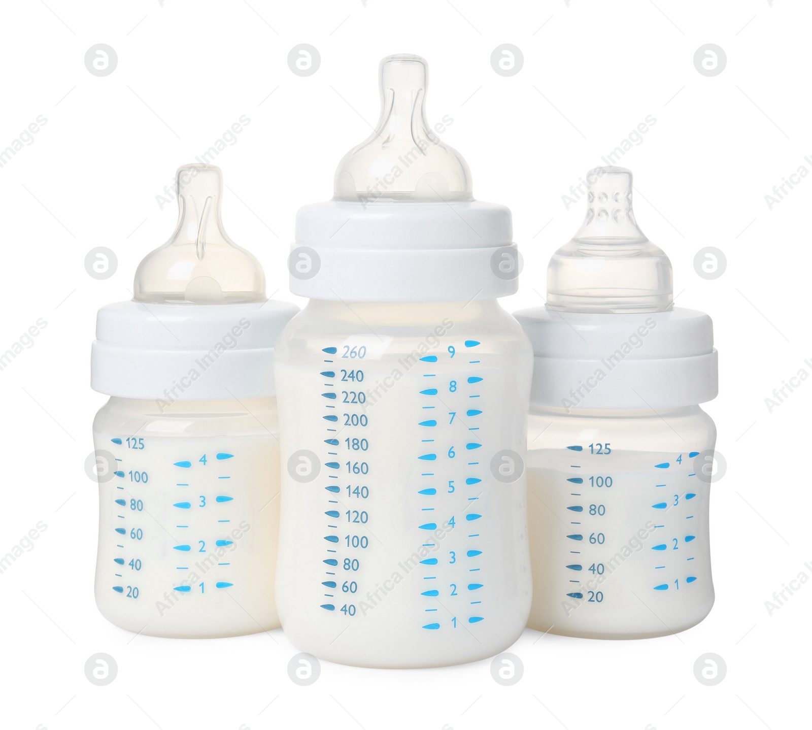 Photo of Three feeding bottles with milk on white background