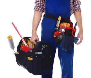 Photo of Construction worker with set of tools on white background, closeup