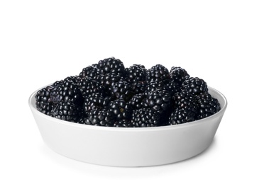 Photo of Bowl with ripe blackberries on white background