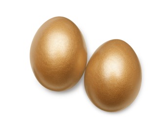 Golden eggs on white background, top view