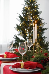 Photo of Beautiful table setting with Christmas decor in room