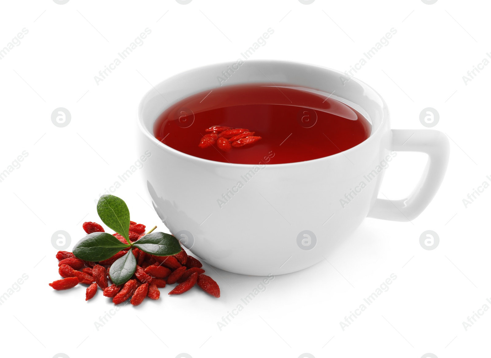 Photo of Healthy goji tea in cup with berries on white background