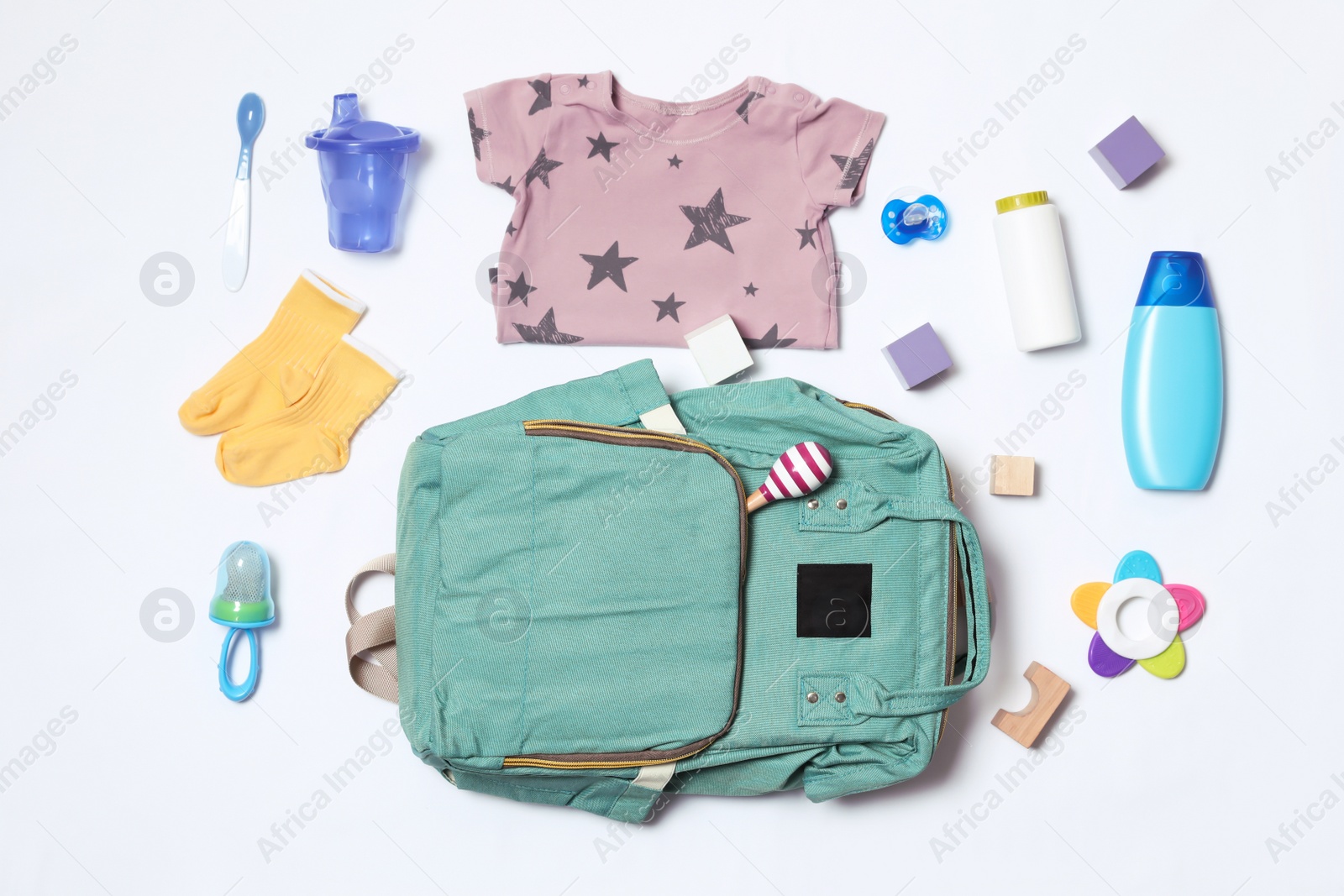 Photo of Composition with maternity backpack and baby accessories on white background, top view