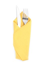 Fork and knife wrapped in yellow napkin on white background, top view