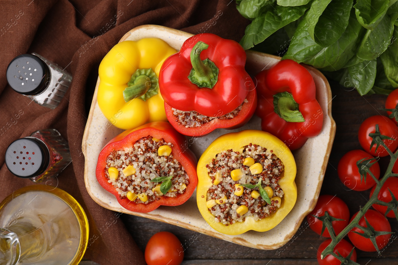 Photo of Flat lay composition with quinoa stuffed bell peppers on wooden table