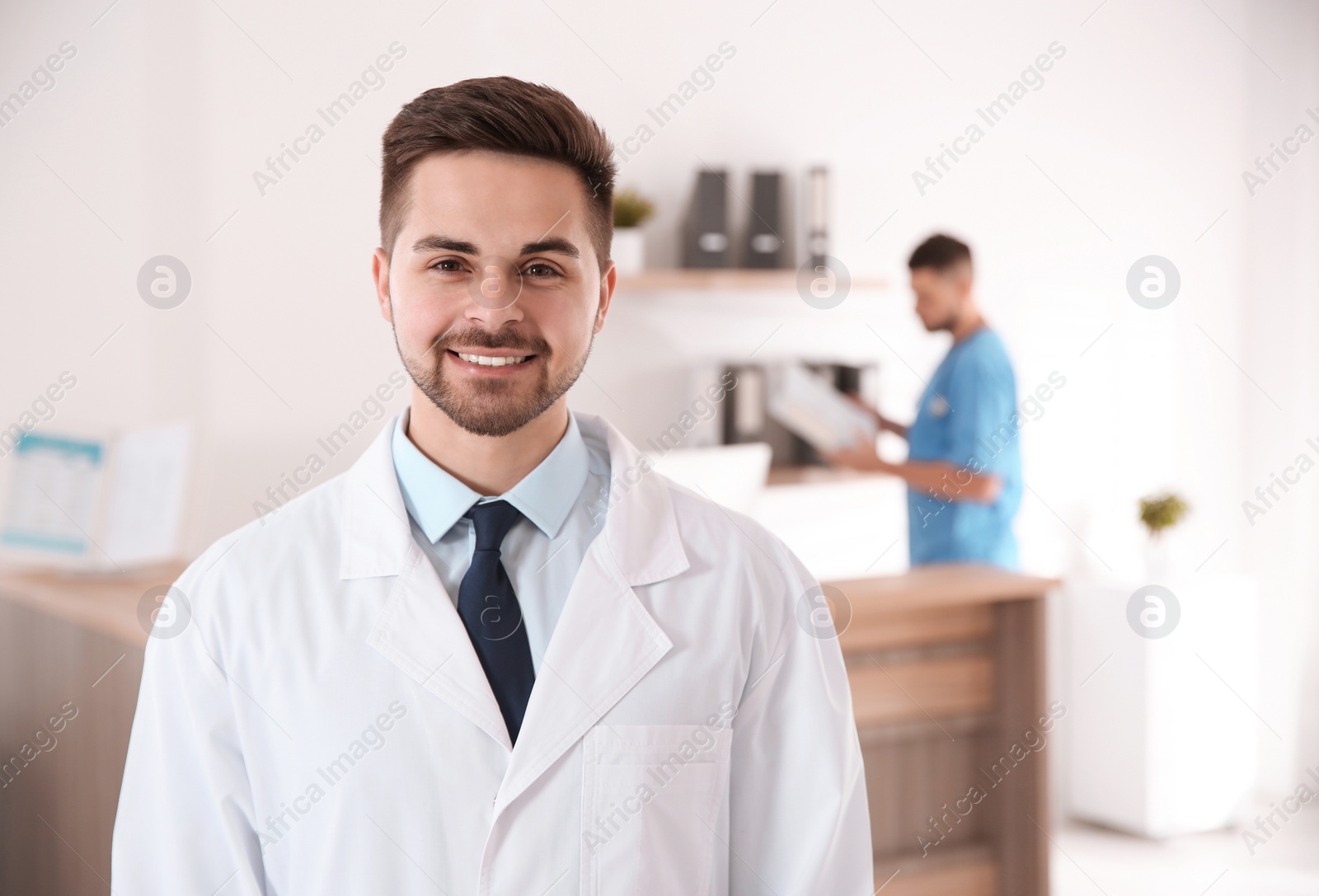 Photo of Portrait of male doctor in modern clinic