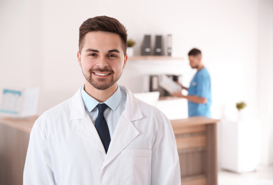 Photo of Portrait of male doctor in modern clinic