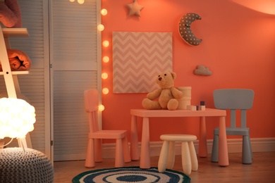 Photo of Modern child room interior with toys and decorations