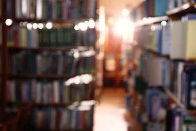 Photo of Blurred view of different books on shelves in library