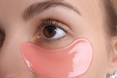 Young woman with under eye patch , closeup