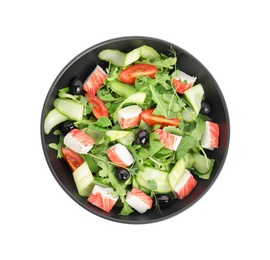 Photo of Delicious crab stick salad in black bowl isolated on white, top view