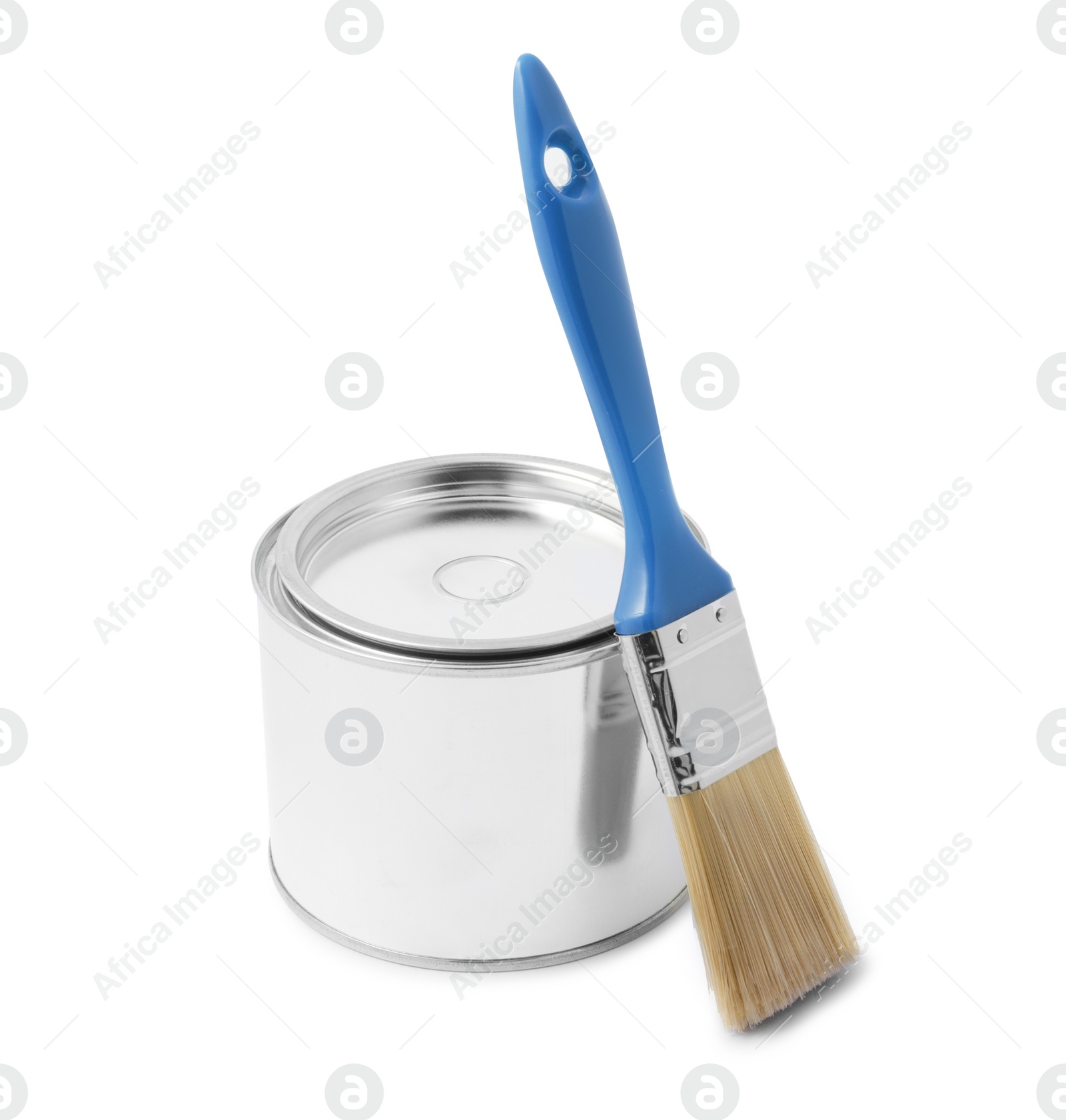 Photo of New metal paint can and brush on white background