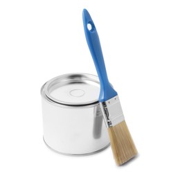 Photo of New metal paint can and brush on white background