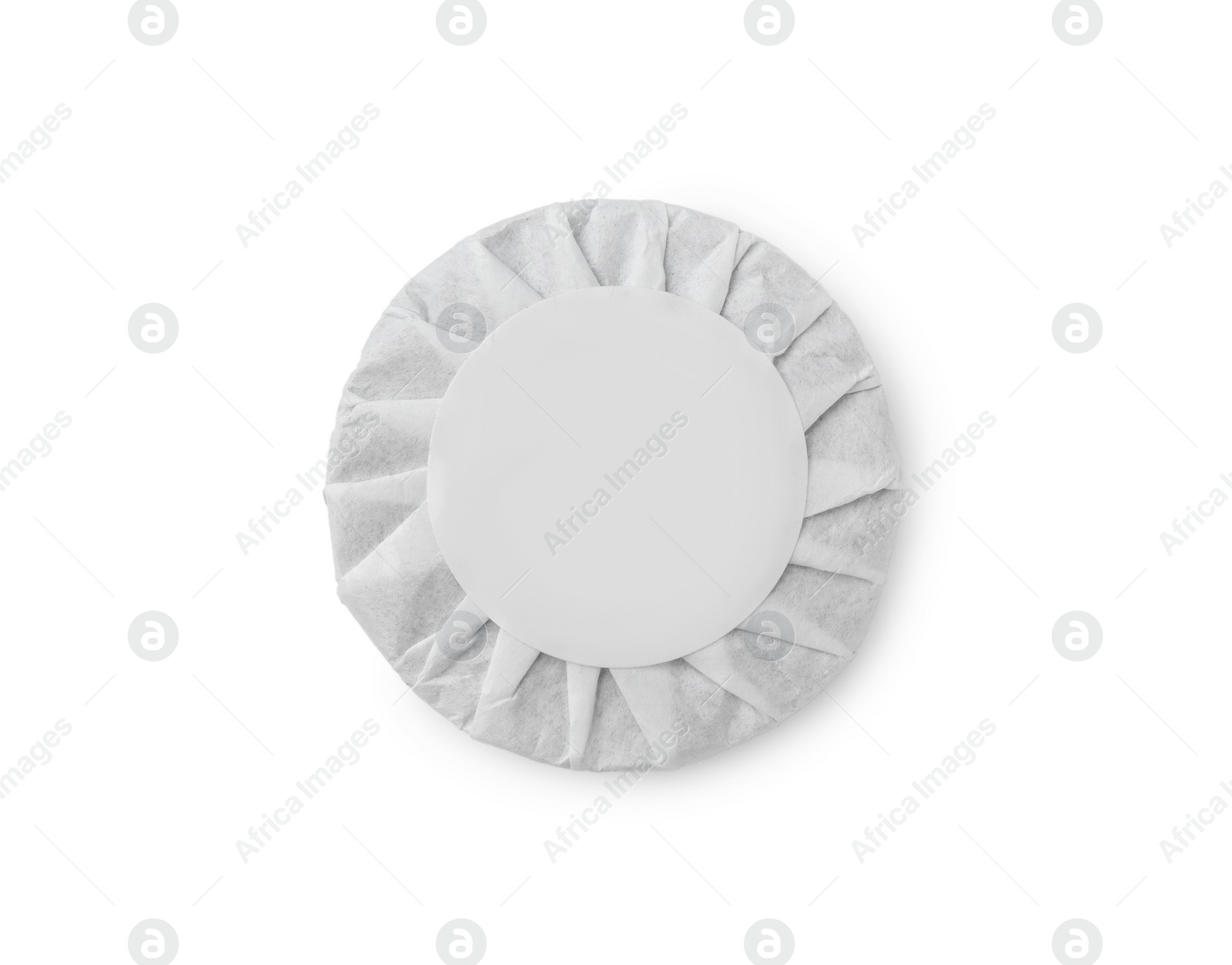 Photo of Disc shaped traditional Chinese pu-erh tea in paper wrap isolated on white, top view