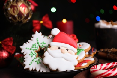 Photo of Bright delicious Christmas cookies on table, closeup