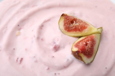 Photo of Tasty yogurt and figs as background, closeup. Space for text