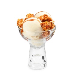Photo of Delicious ice cream with caramel popcorn and sauce in glass dessert bowl on white background