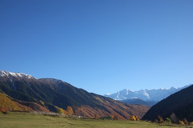 Photo of Picturesque view of beautiful high mountains under blue sky on sunny day