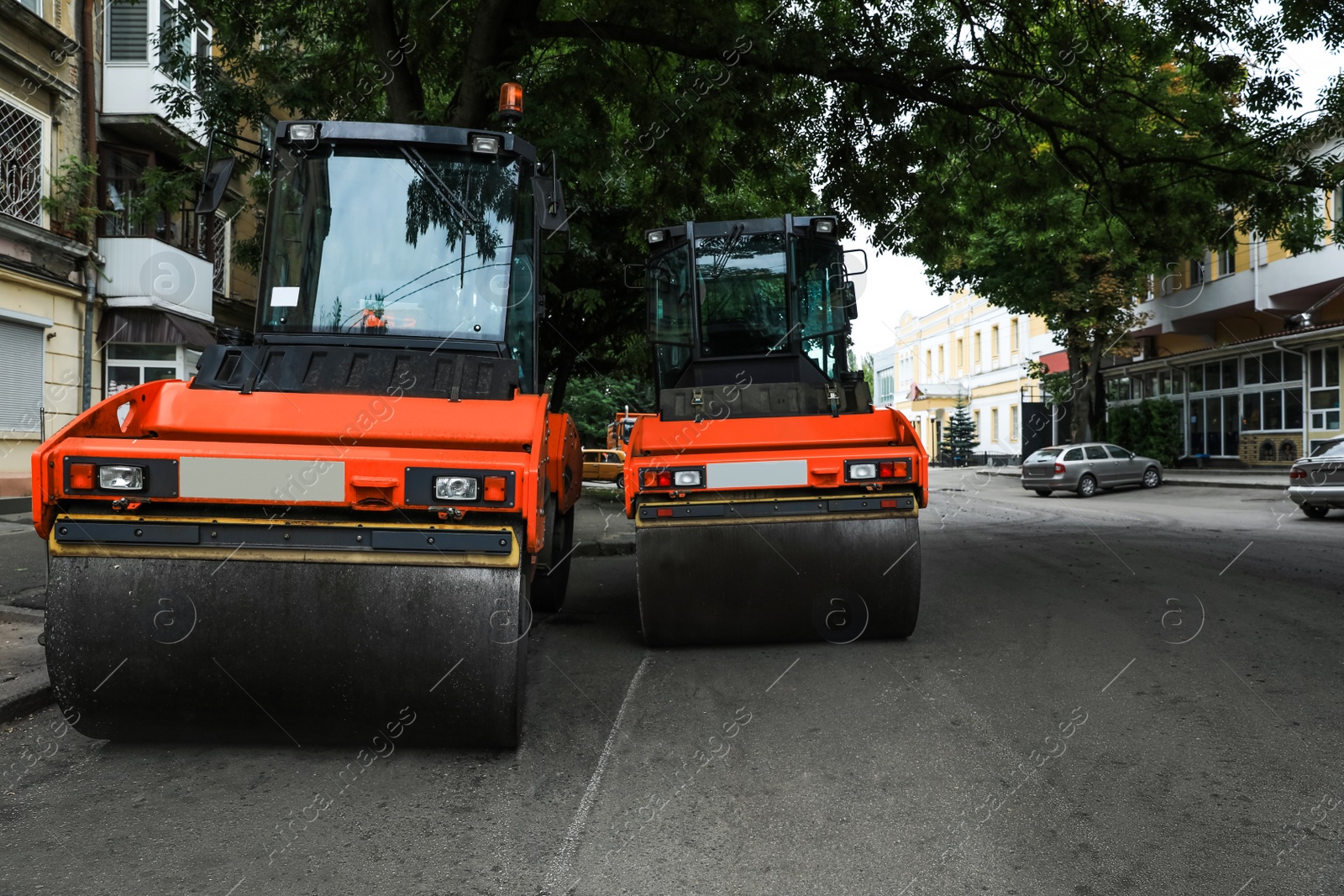 Photo of Modern rollers on city street. Road repair service