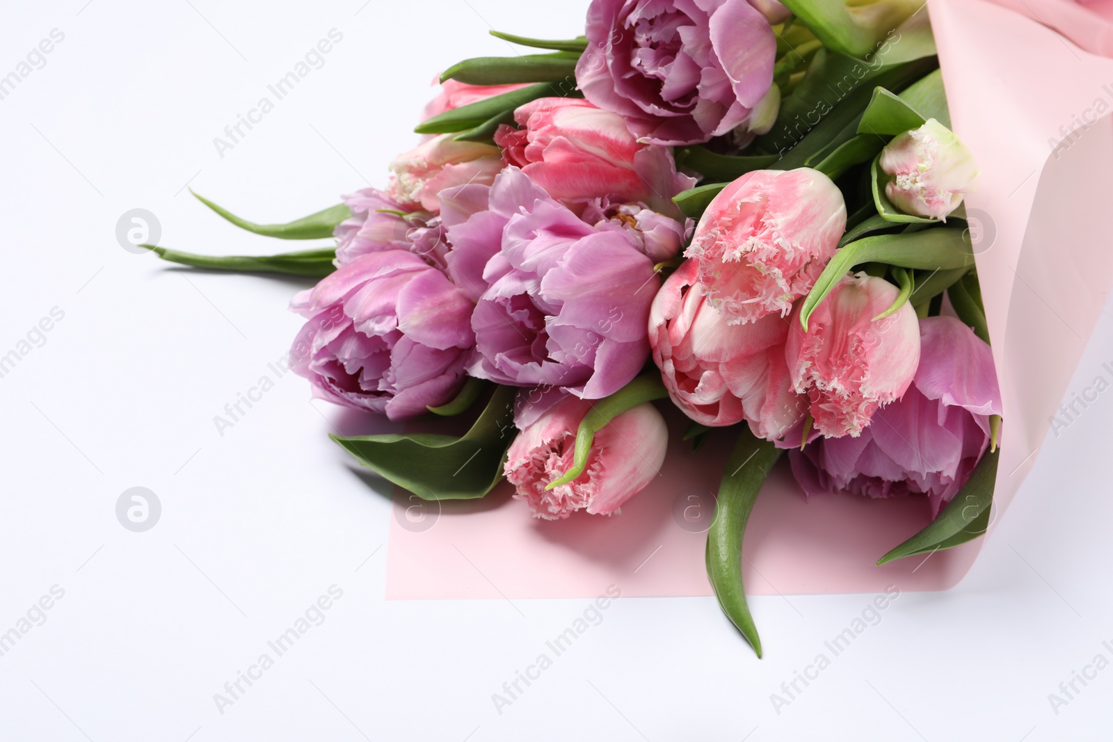 Photo of Beautiful bouquet of colorful tulip flowers on white background