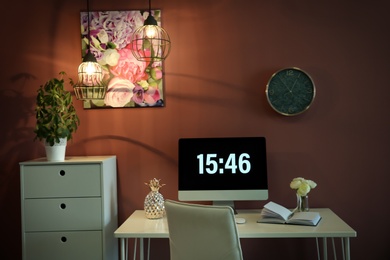 Photo of Stylish workplace interior with computer monitor on table