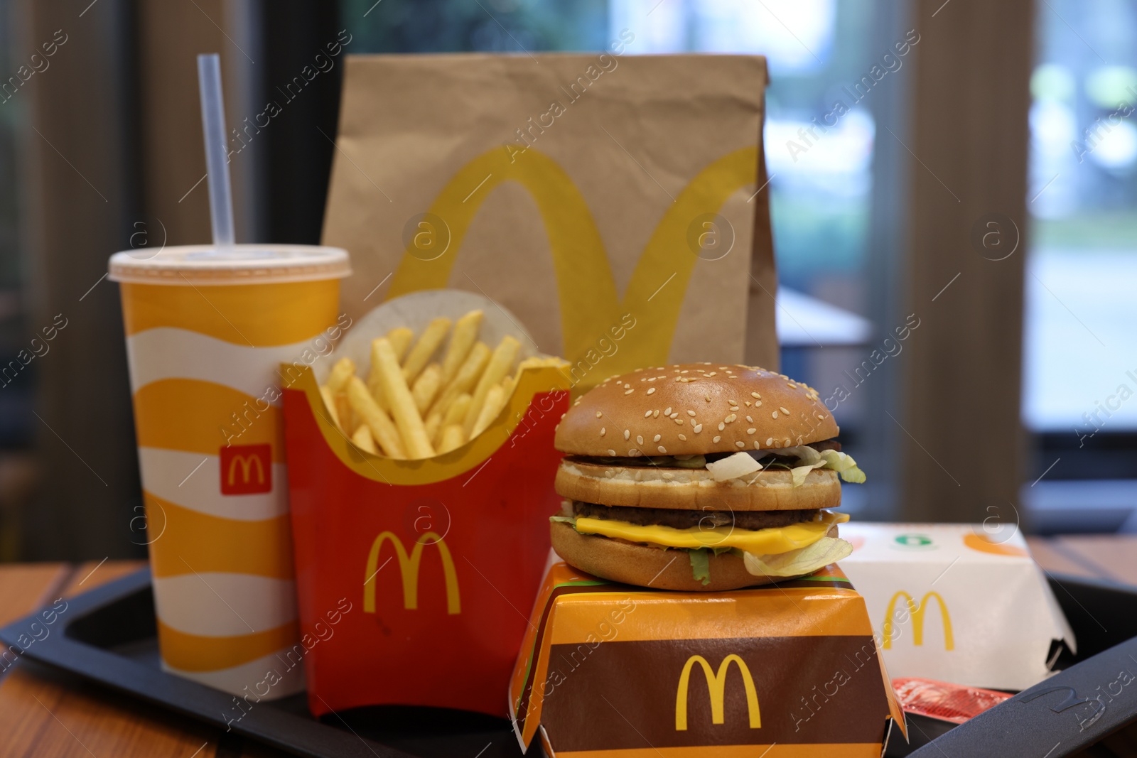 Photo of Lviv, Ukraine - October 9, 2023: McDonald's menu on wooden table in restaurant