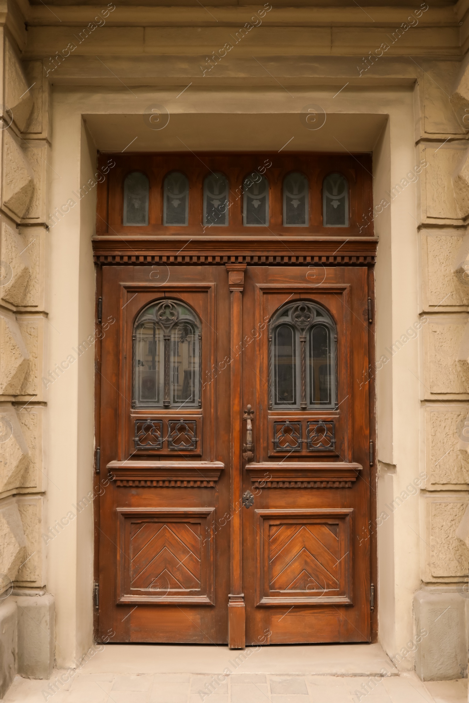 Photo of View of building with big vintage wooden door. Exterior design