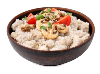 Delicious barley porridge with mushrooms, tomatoes and microgreens in bowl isolated on white