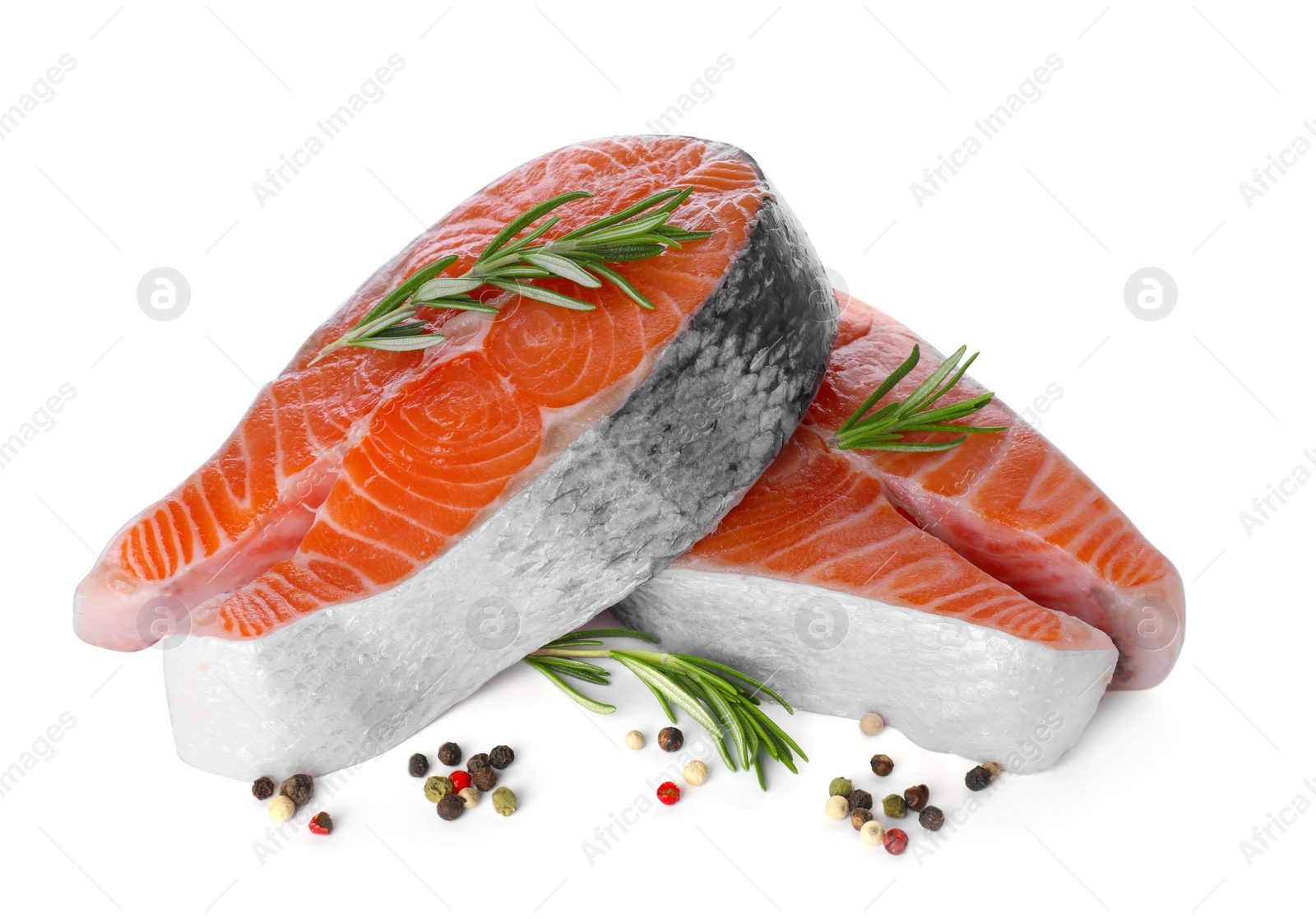 Photo of Fresh raw salmon steaks with rosemary and peppercorns on white background