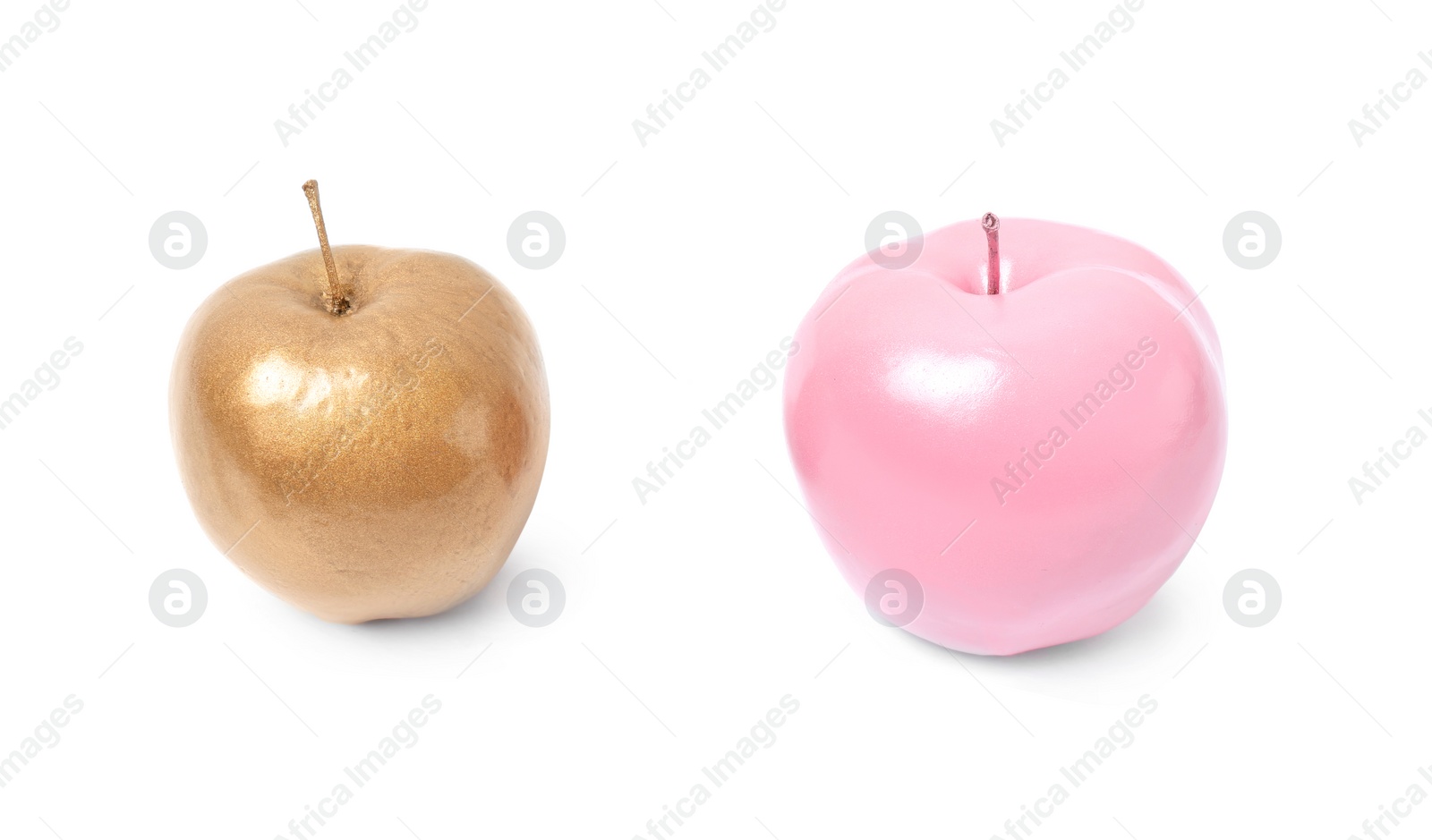 Photo of Shiny stylish gold and pink apples on white background