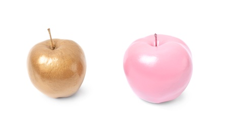 Shiny stylish gold and pink apples on white background