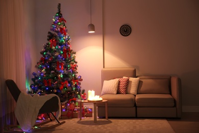 Photo of Stylish room interior with decorated Christmas tree