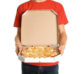 Photo of Young man with opened pizza box on white background. Food delivery service