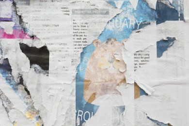 Photo of Different creased torn paper posters as background