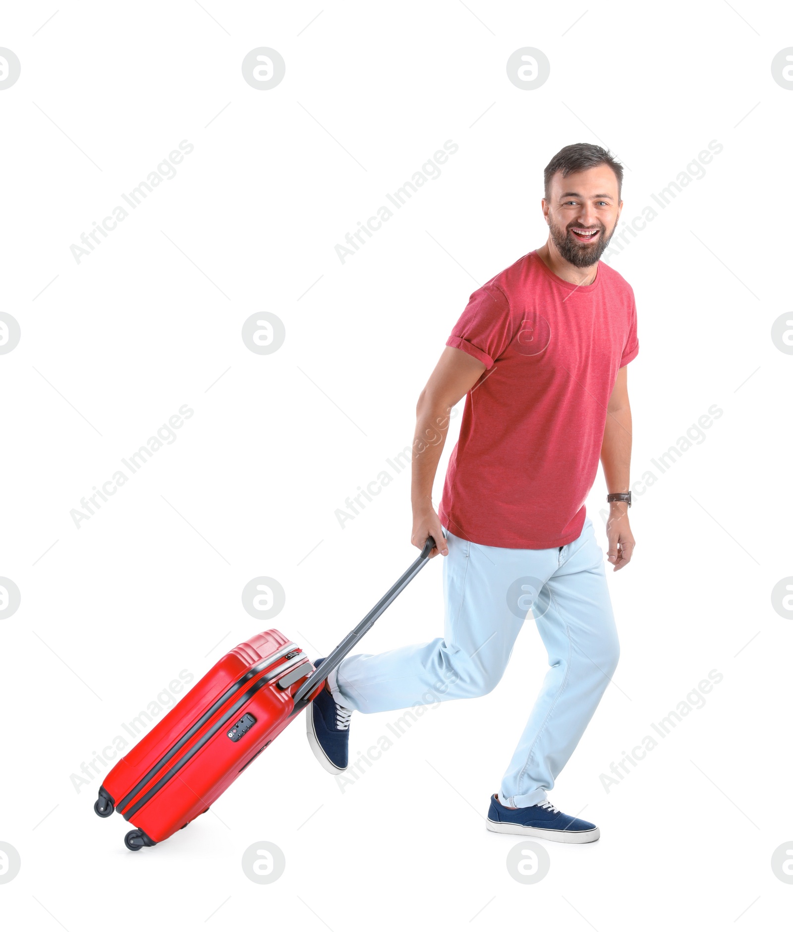 Photo of Man with suitcase running on white background. Vacation travel