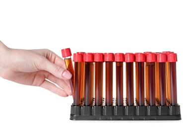 Photo of Woman taking test tube with brown liquid from stand on white background, closeup