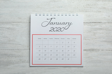 January 2020 calendar on white wooden background, top view