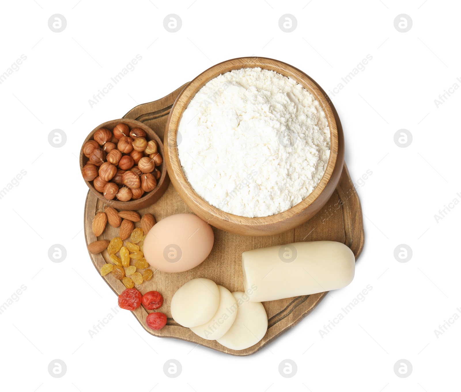 Photo of Marzipan and other ingredients for homemade Stollen on white background, top view. Baking traditional German Christmas bread