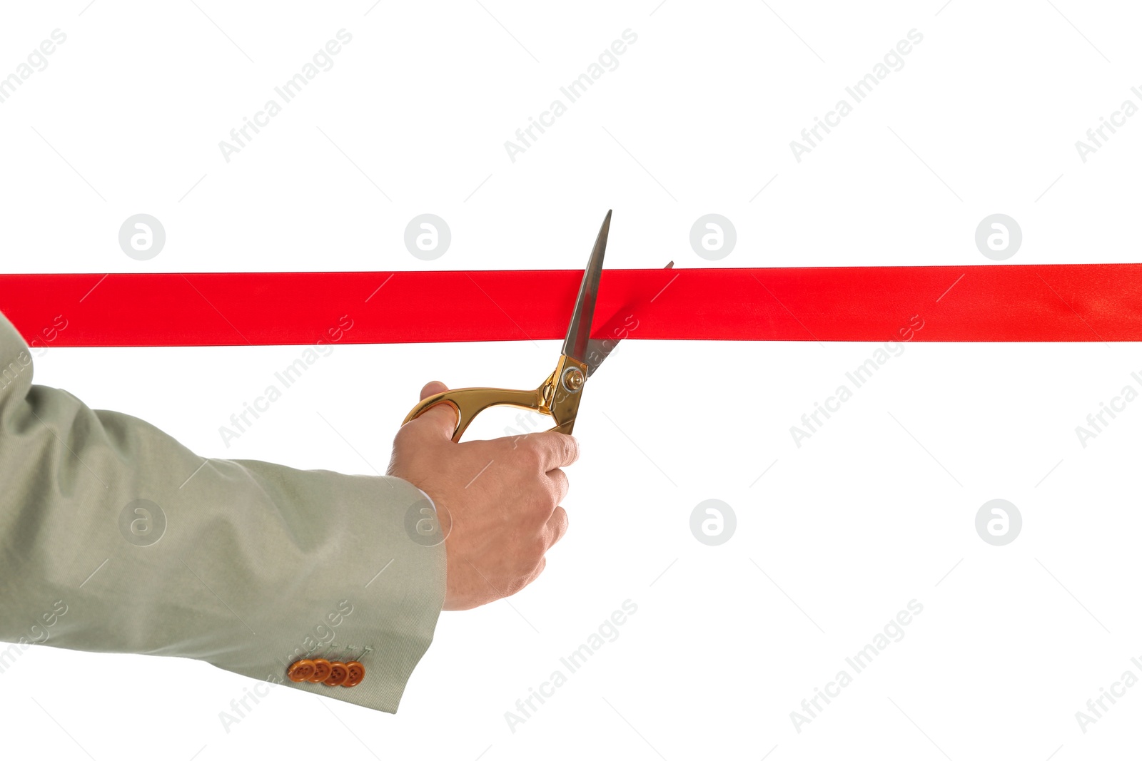 Photo of Man in office suit cutting red ribbon isolated on white, closeup
