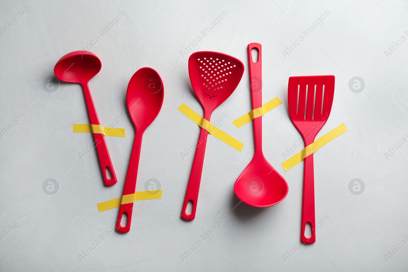 Photo of Set of clean kitchen utensils on grey background, flat lay