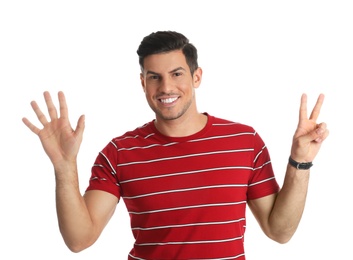 Photo of Man showing number seven with his hands on white background