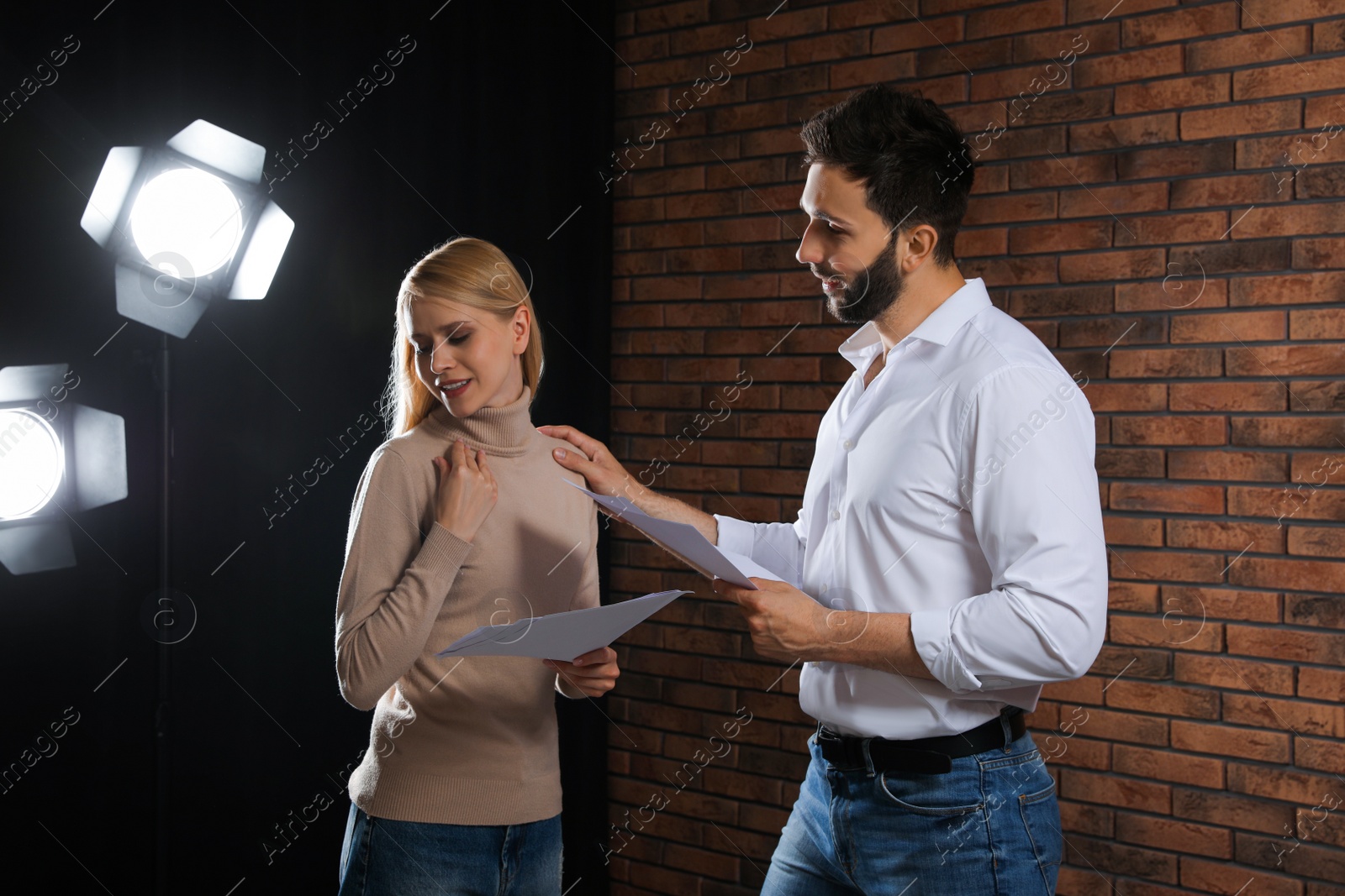 Photo of Professional actors rehearsing on stage in theatre