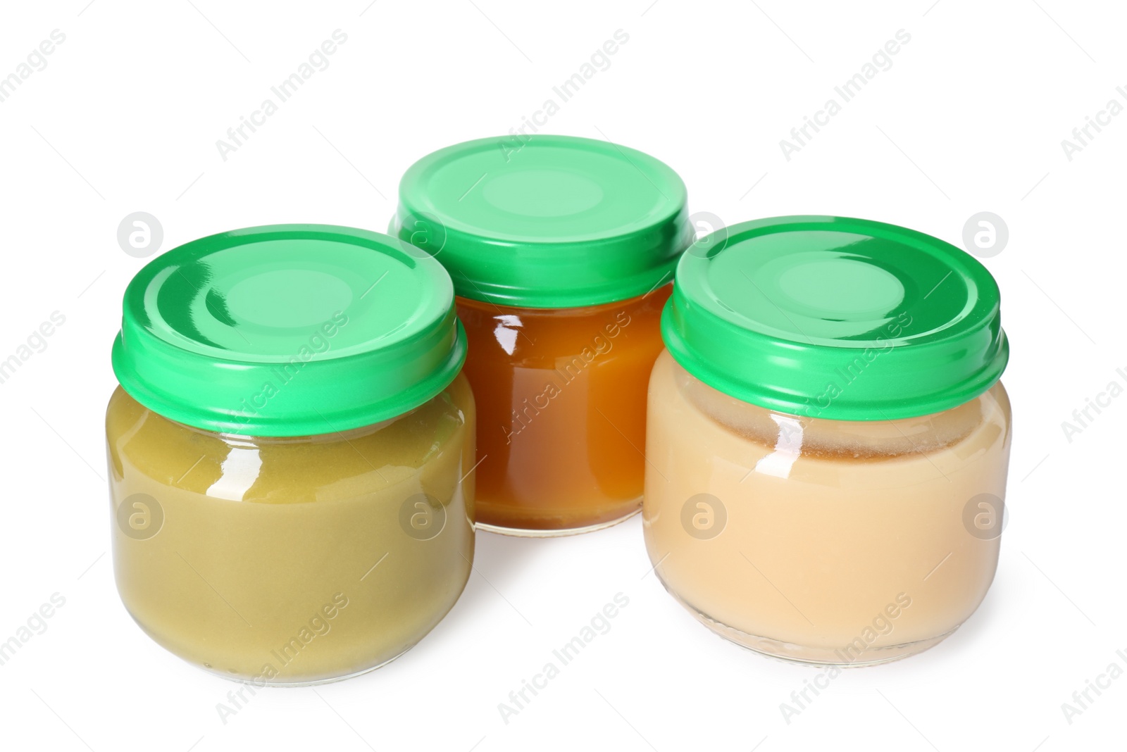 Photo of Baby food. Different healthy puree in jars isolated on white