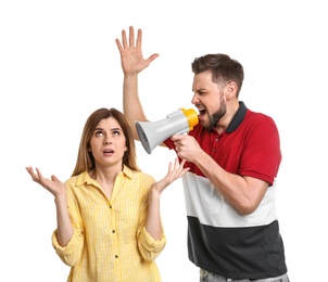 Photo of Young man with megaphone shouting at woman on white background