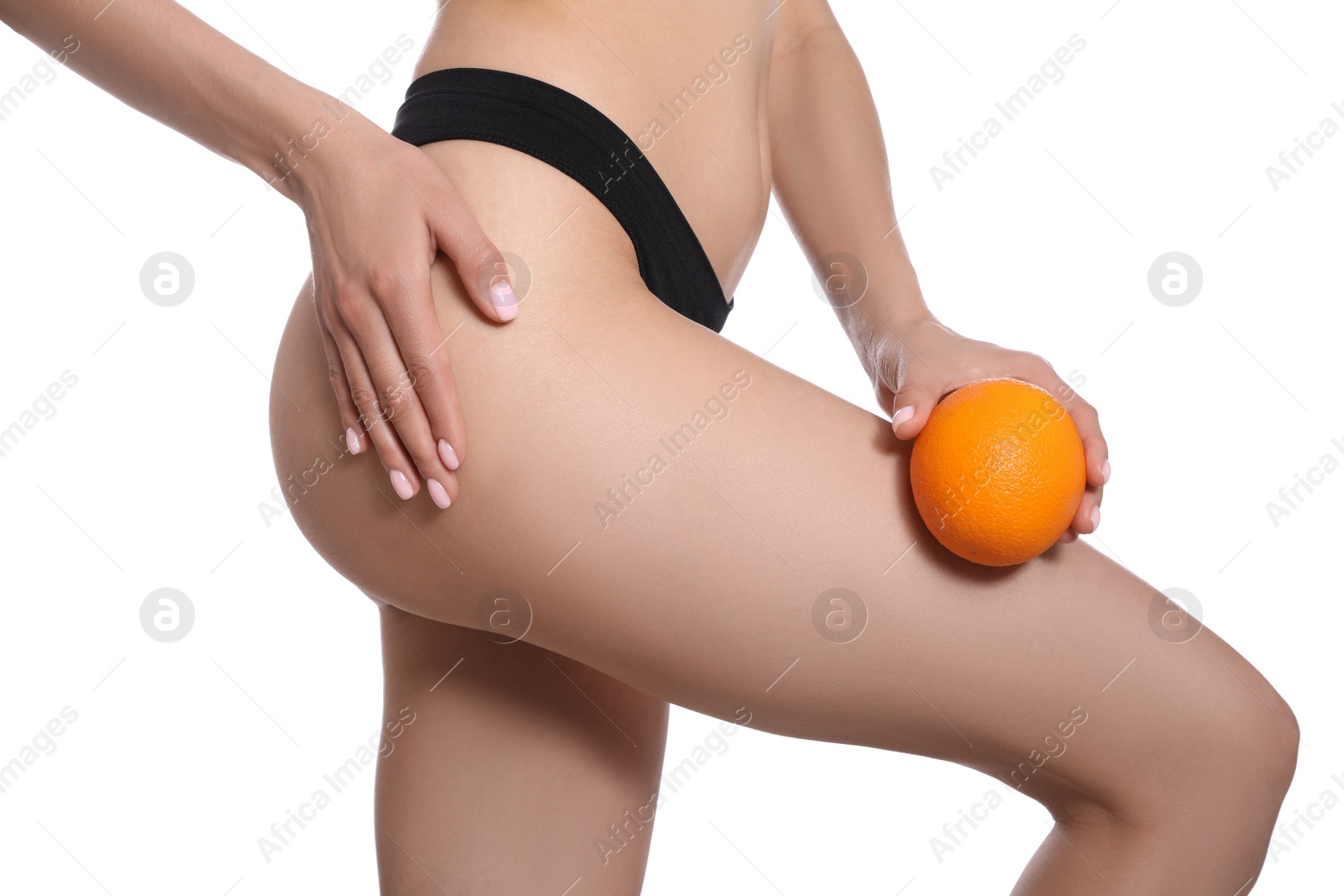 Photo of Closeup view of slim woman in underwear with orange on white background. Cellulite problem concept